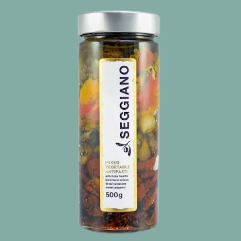 Jar of Seggiano mixed vegetable antipasti on a green background