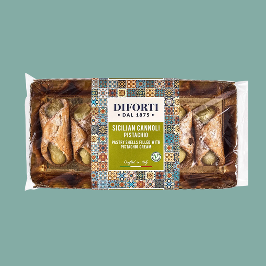 A packaged of DIFORTI Sicilian Cannoli Pistacchio pastry shells filled with pistachio cream, shown on a solid muted teal background.
