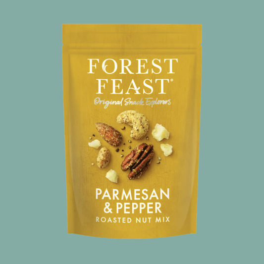 Forest Feast Parmesan & Pepper Roasted Nut Mix in a golden-yellow resealable pouch, featuring illustrations of almonds, pecans, and parmesan cheese pieces on the front, set against a solid teal background.