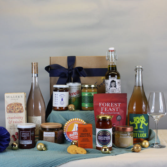 Assorted food and drink products on a table with a neutral background