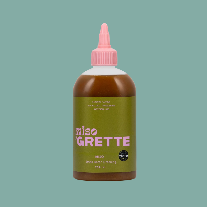 Bottle of Miso Grette on a solid background