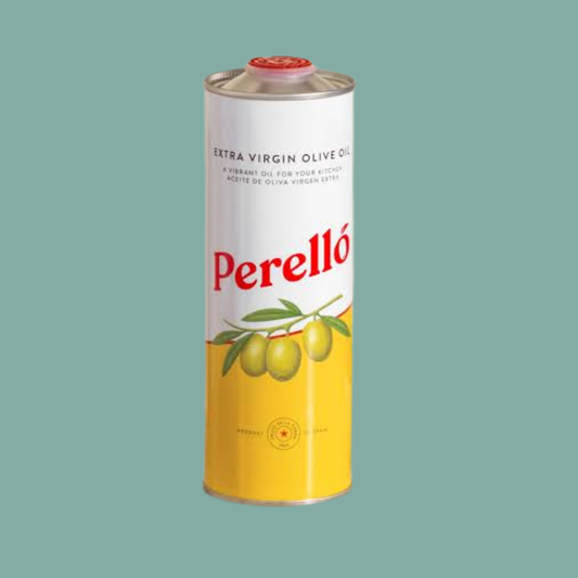 A tall cylindrical metal can of Perelló extra virgin olive oil, featuring a white upper half with red Perelló branding and green olive illustrations, and a yellow lower half, set against a solid teal background.