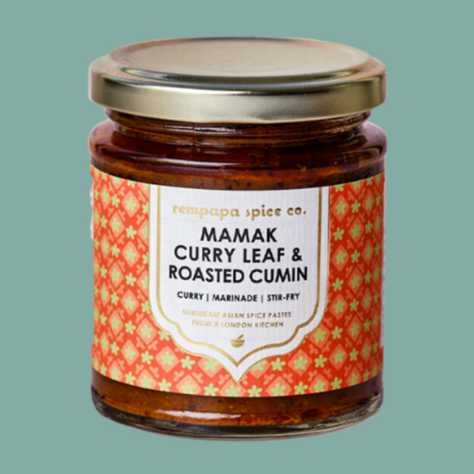 Jar of Mamak Curry Leaf & Roasted Cumin spice mix on a green background