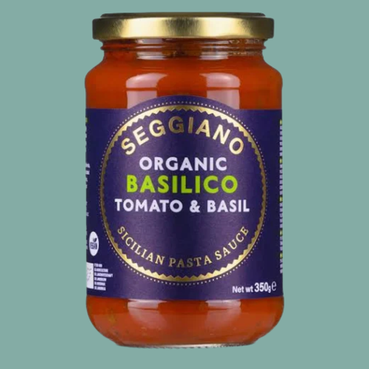 Jar of Seggiano Organic Basilico Tomato & Basil Sicilian Pasta Sauce on a green background